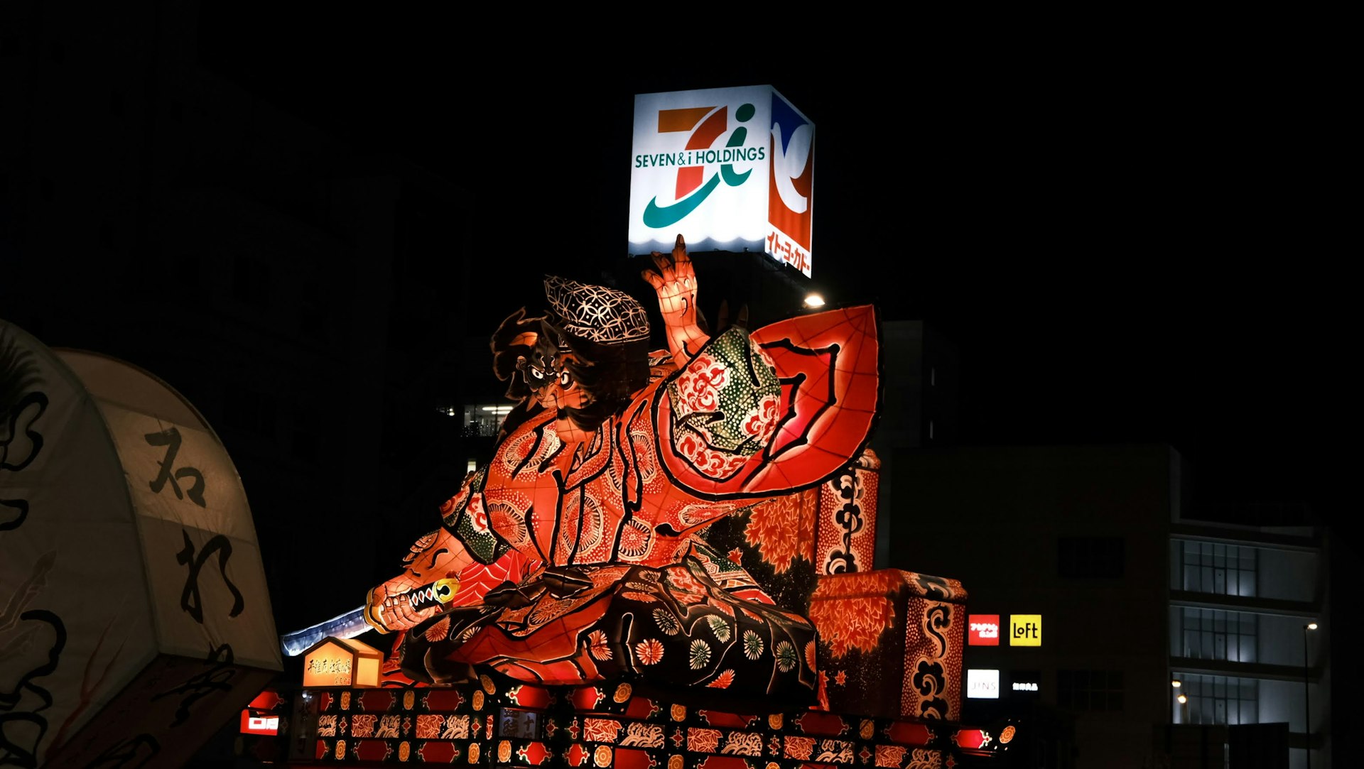 a large statue of a man on top of a truck